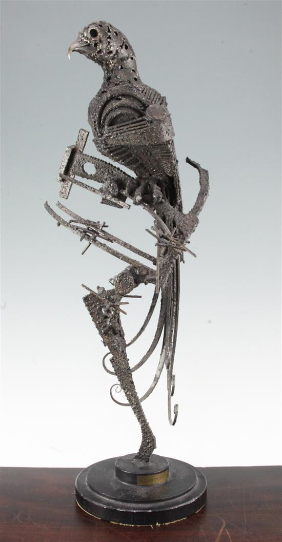Walenty Pytel (Polish, b.1941). A large textured steel model of a parrot on a perch, 25.5in.